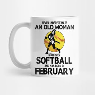 Never Underestimate A Woman Loves Softball Born In February Mug